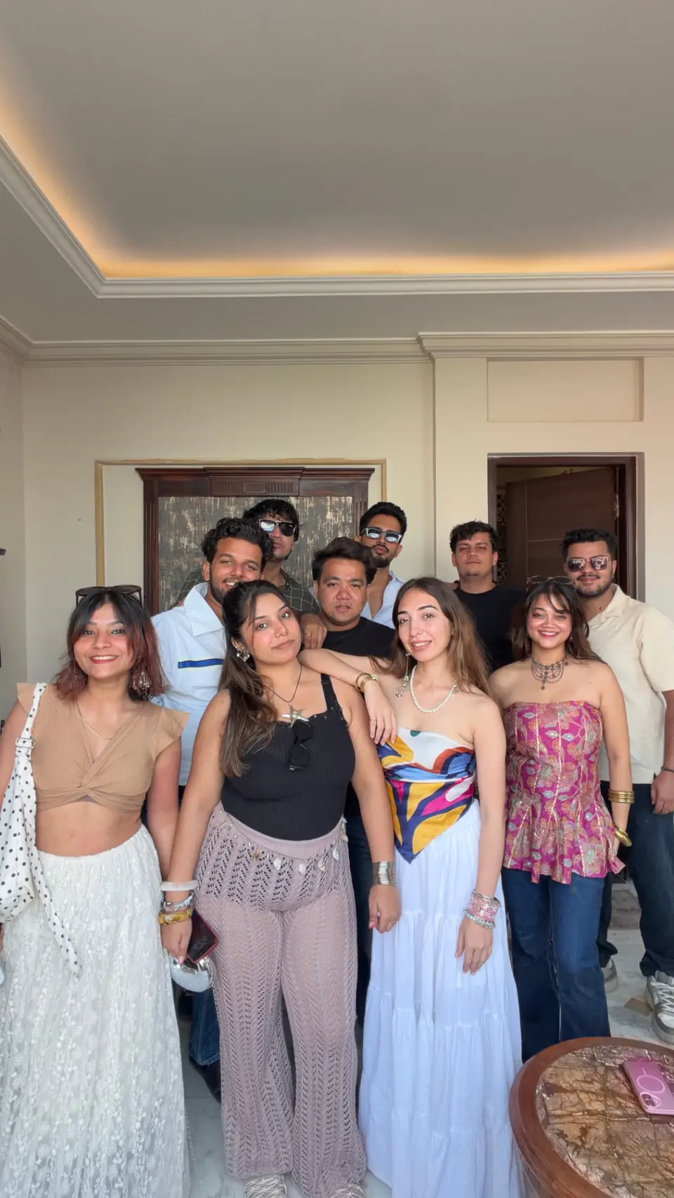 The whole group standing together indoors before heading out